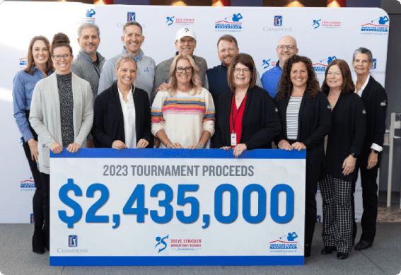 People surrounding a donation check at AmFam Championships