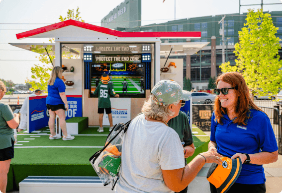 People in front of American Family Insurance branded booth