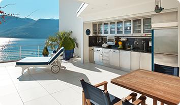 a kitchen with a pool and a table