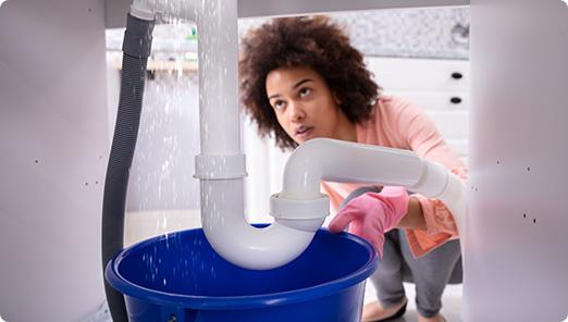 a person using a blue bucket