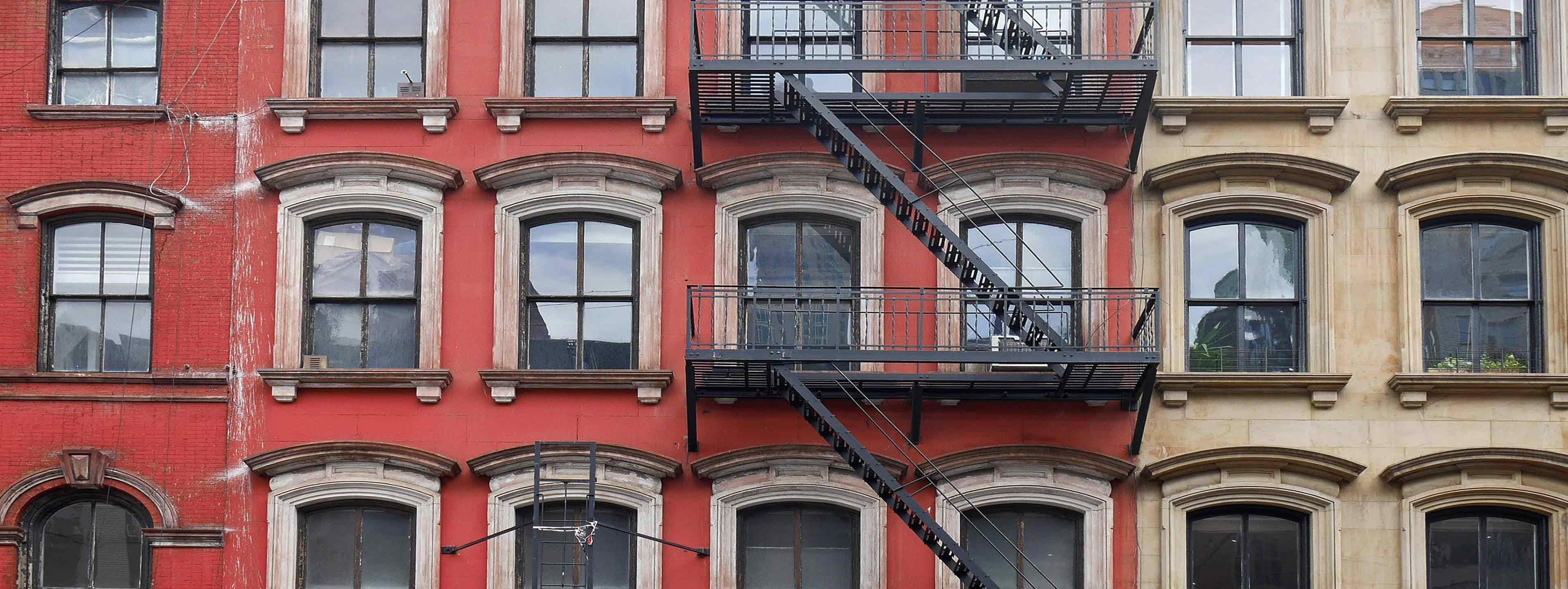 a building with windows and balconies