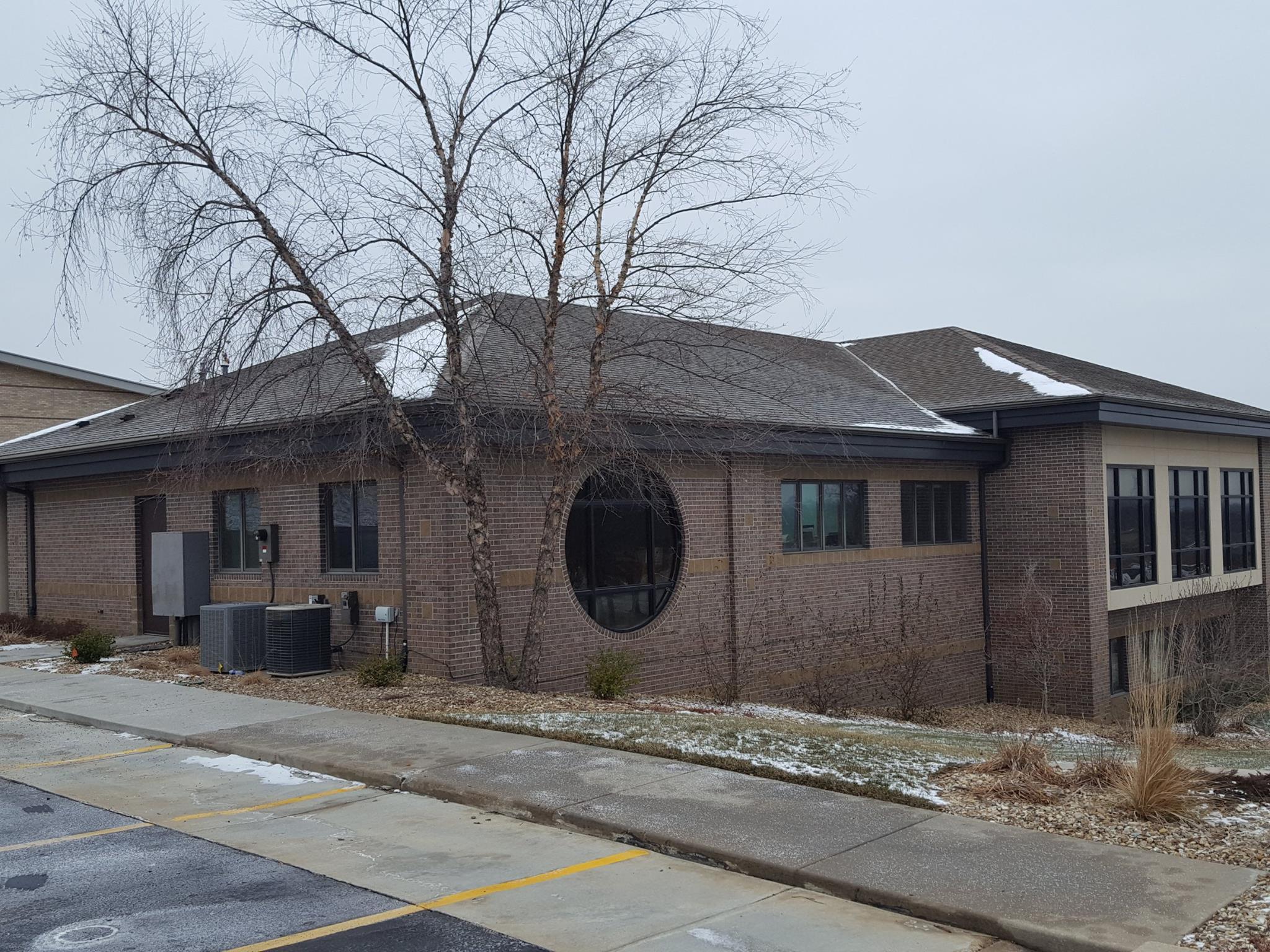 a brick building with a large arched doorway