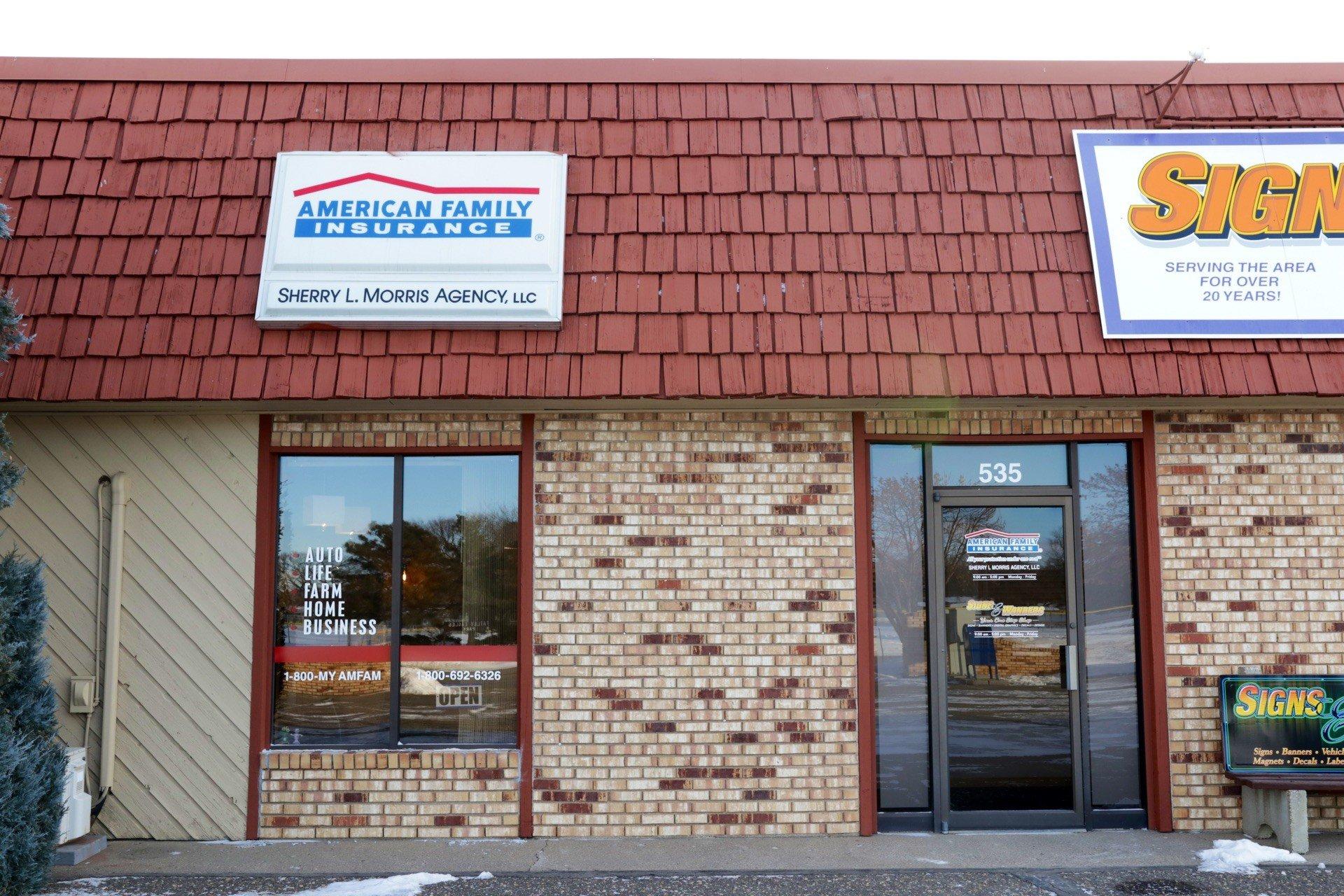 a brick building with a sign on the front