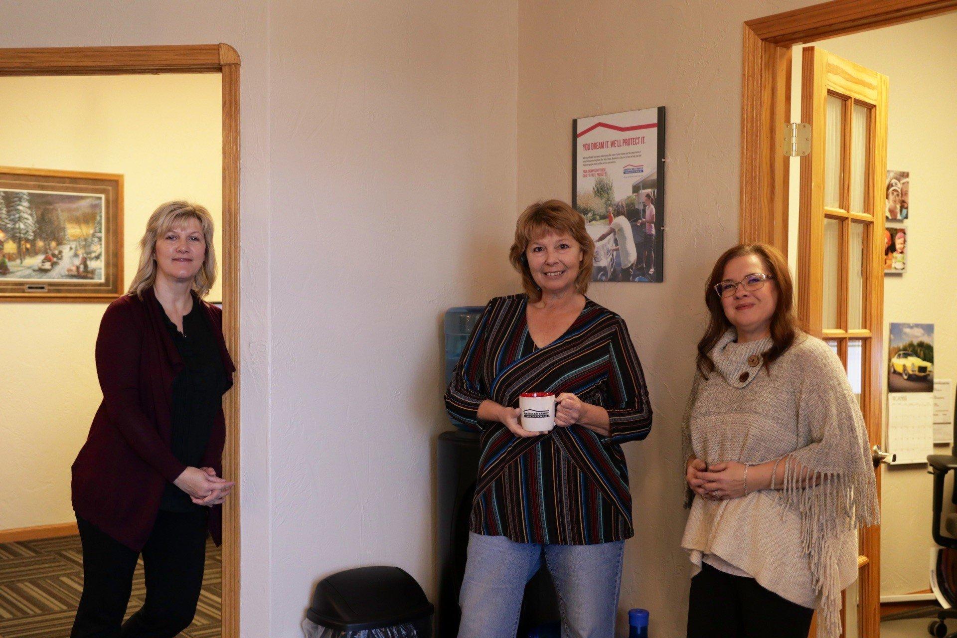 a group of women standing in a room