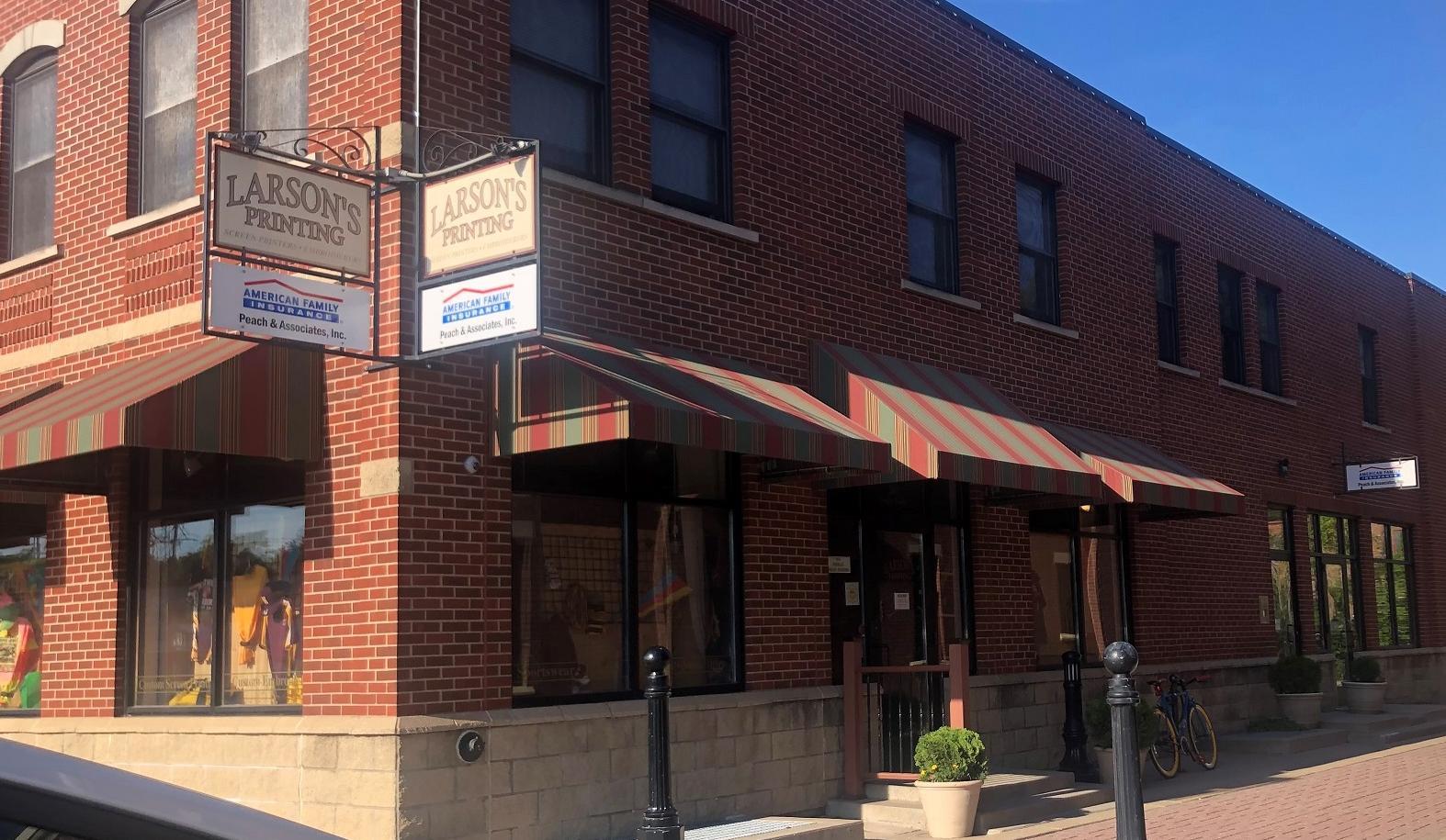 a brick building with a sign