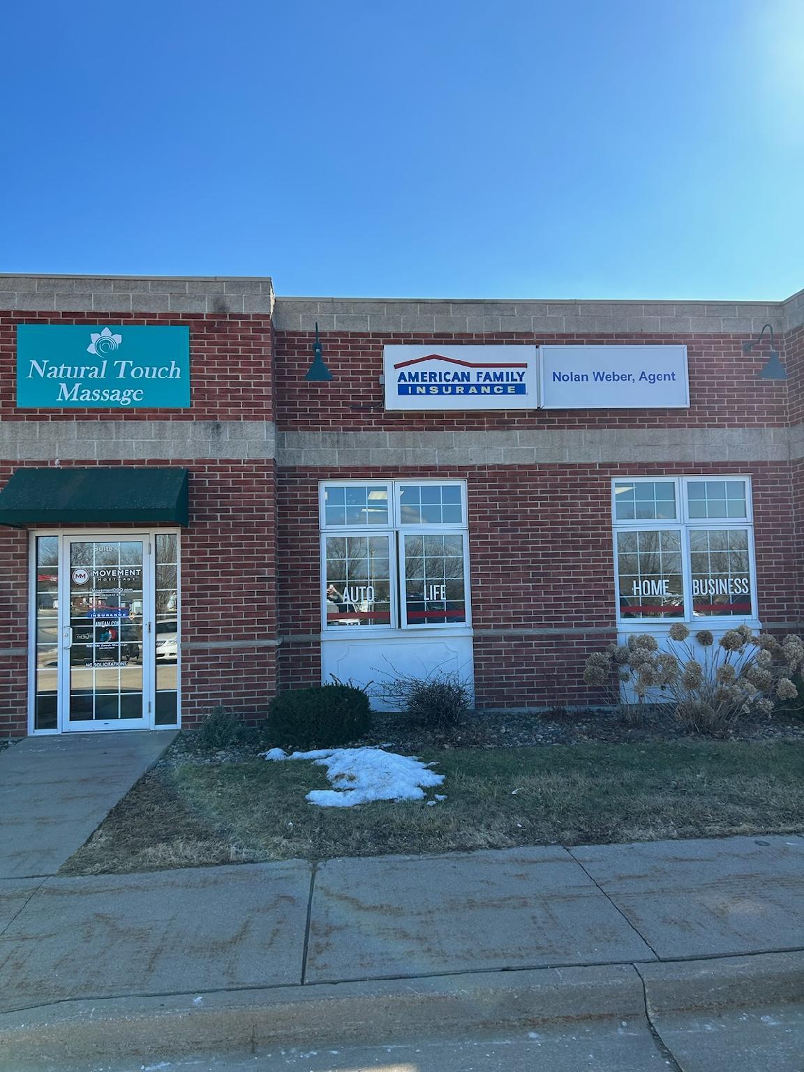 a brick building with signs on the front