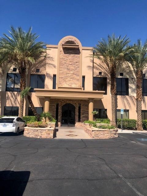 a building with palm trees