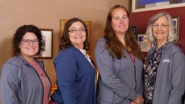 a group of women smiling