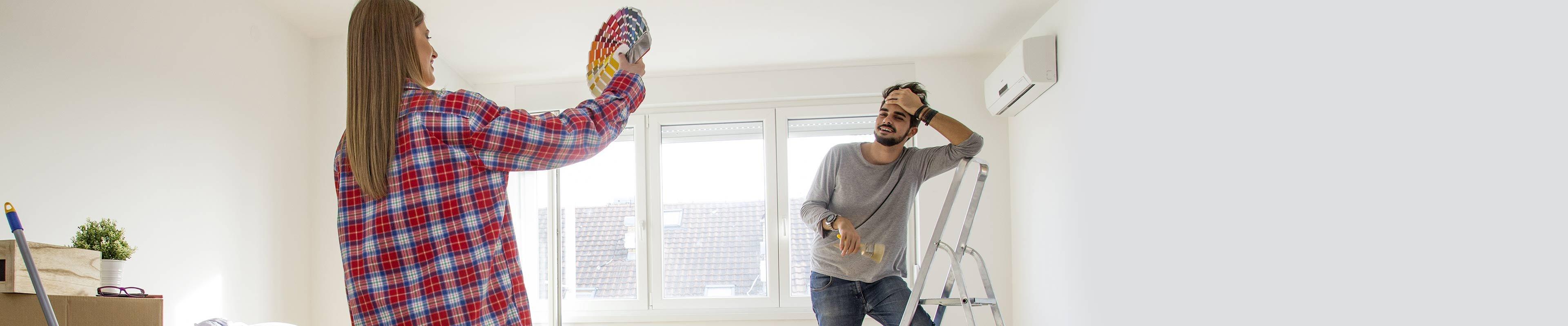 Young couple deciding if they should move or remodel.