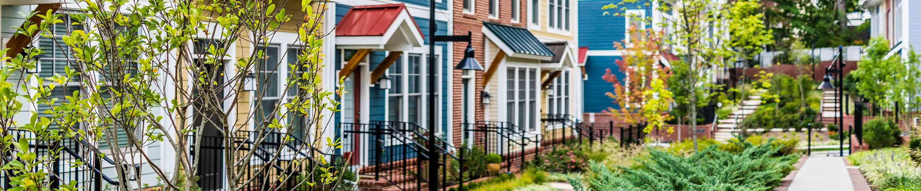 A row of townhouses in a nice neighborhood.