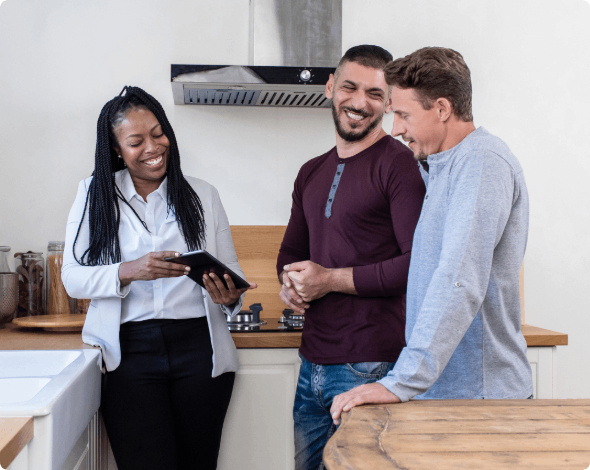 Landlord showing a happy couple a home rental.