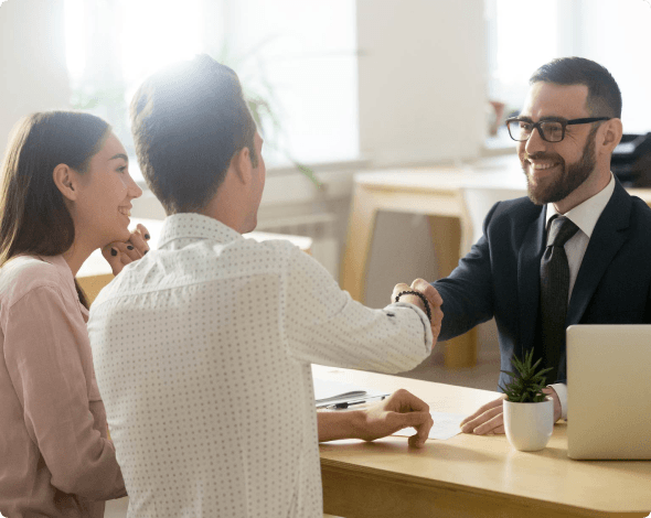 Young couple asking agent about home insurance.