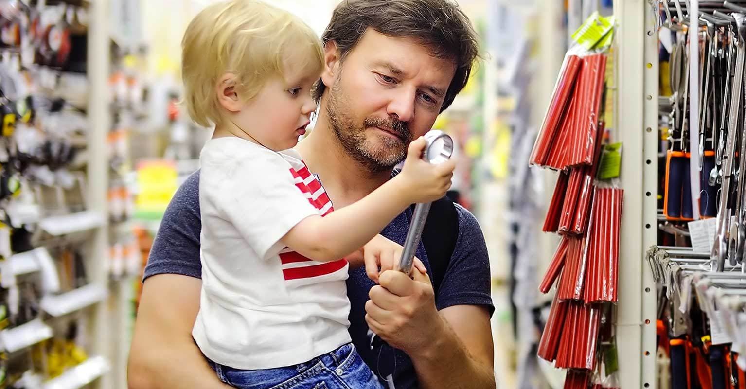 Man and child looking at tools