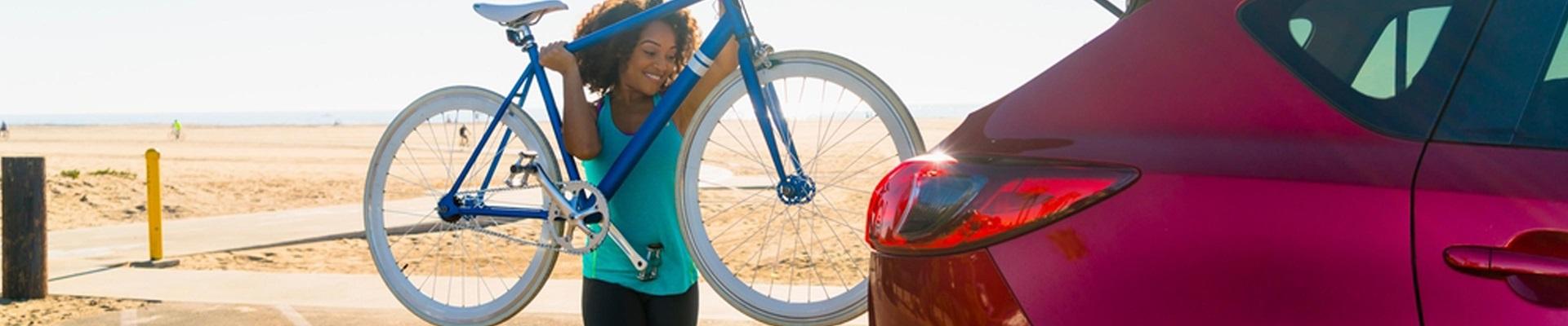 a person holding a bicycle