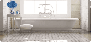 a bathtub with a stool in a bathroom