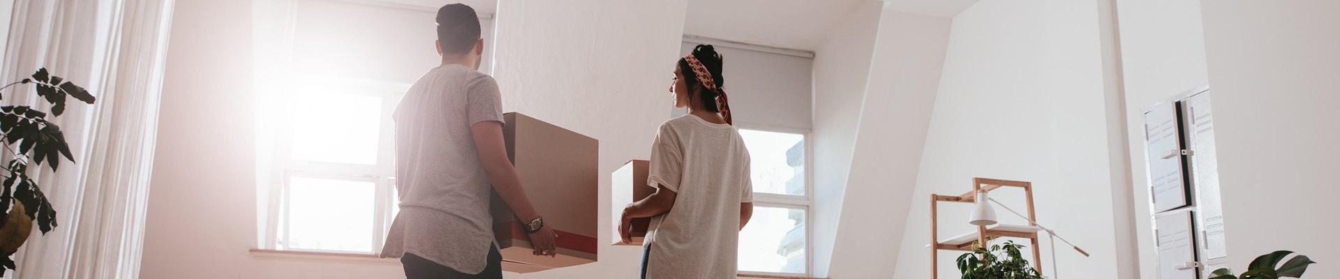 a man and woman walking in a room