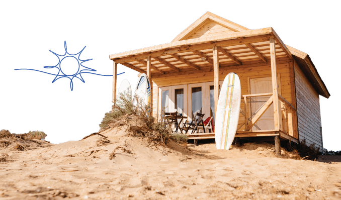 a small shack with a surfboard in the front